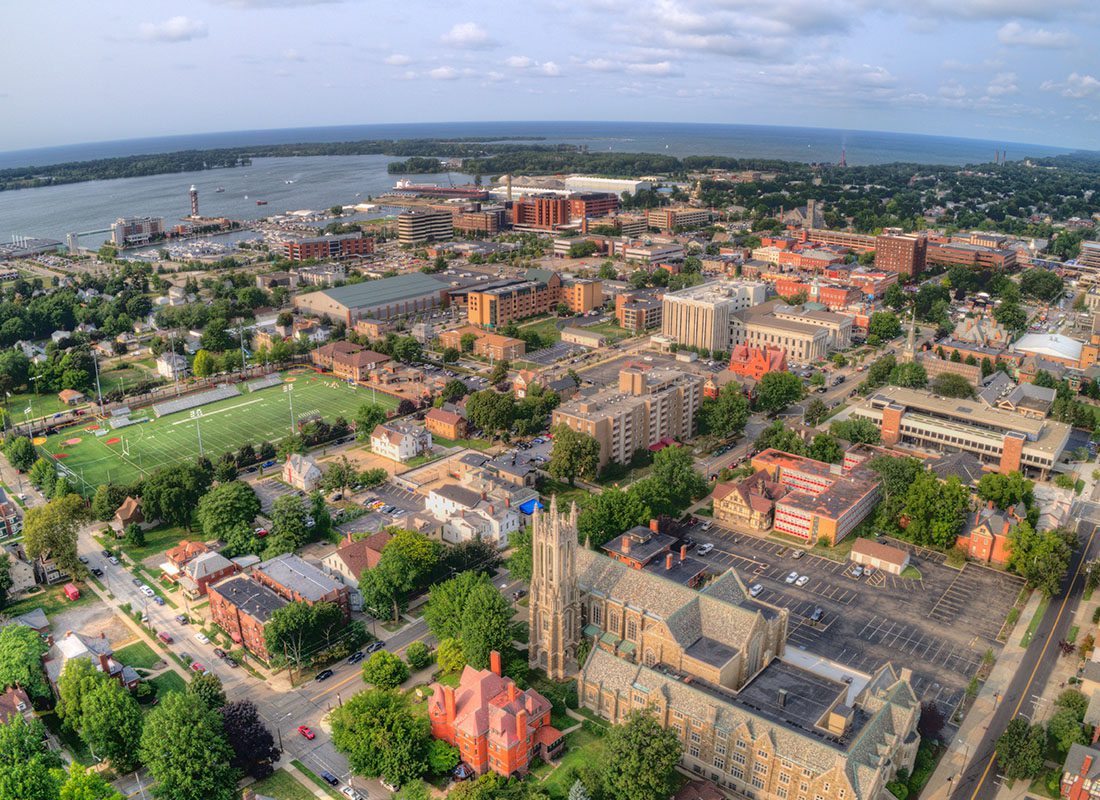 Erie, PA - Aerial View of Erie, PA With Many Buildings and Lake Erie