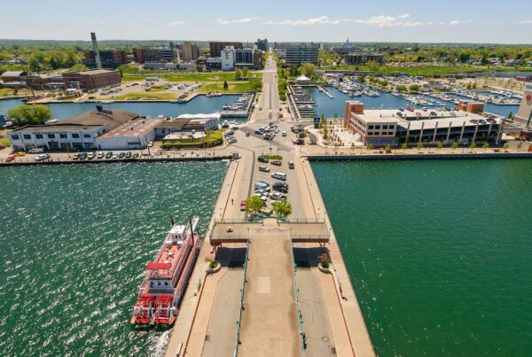 Homepage - Aerial View of Erie Skyline on a Sunny Day With Calm Water